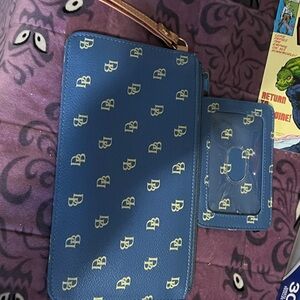 Dooney & Bourke Blue Wristlet with White Logo